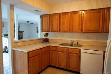 Kitchen opens to living room and dining room