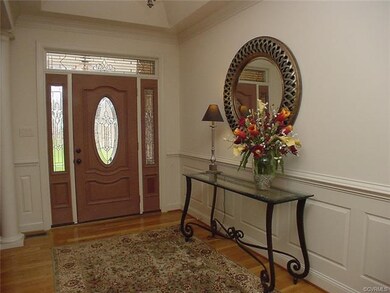 Foyer has raised panel wainscotting w chair rail, 