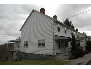 Exterior Front. Side view of 17 Maple