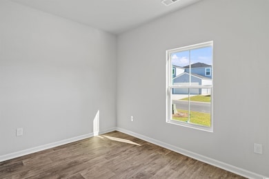 Spare room featuring hardwood / wood-style floors 