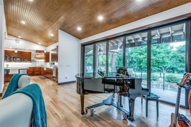 Living room movable wall of windows that open to create a seamless experience with the outdoors