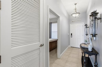 Entryway with view of front door and door to bedroom 1