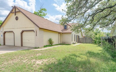 View of side of property with brick siding, concr