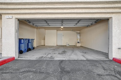 Garage featuring water heater