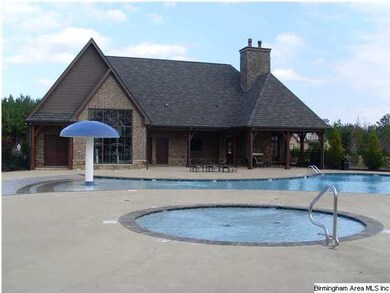 BACK OF CLUB HOUSE WITH TOT POOL AND FOUNTAIN