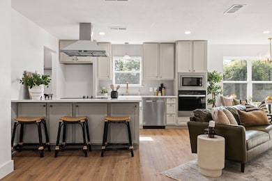 Kitchen featuring appliances with stainless steel 