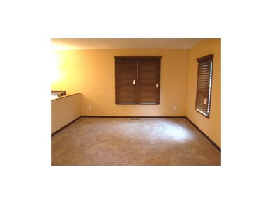 Living Room.  New carpet and window blinds.