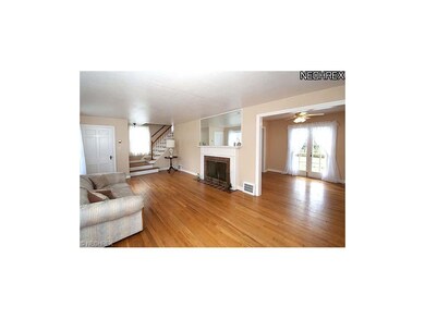 Another view of living room leading to dining room