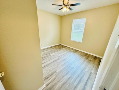Spare room with wood finished floors, a ceiling f