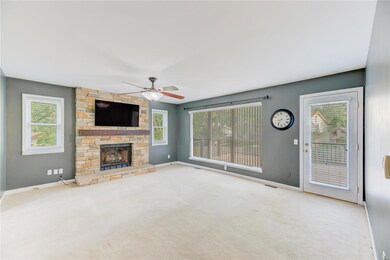 Family Room with Gas Fireplace and Atrium Door to 