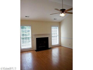 Living Room. Open and filled with light. Gas fireplace and french doors to the deck.