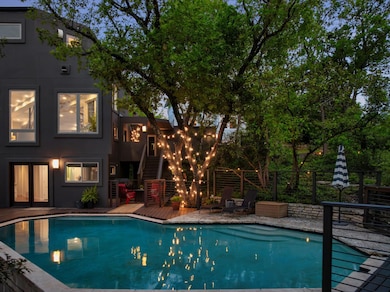 Swimming pool with a wooden deck and stairway