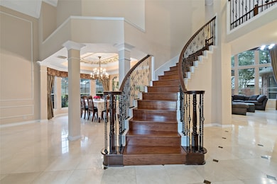 This elegant foyer makes an unforgettable first im