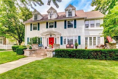 Classic Three Story with Welcoming Front Porch
