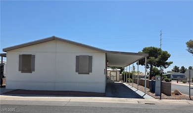 View of property exterior featuring a carport