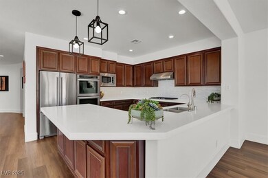 Kitchen featuring backsplash, under cabinet range