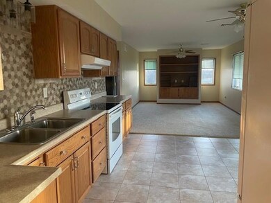 Kitchen area looking into second family room