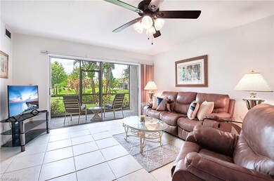 Living Room with sliding glass doors to screened l