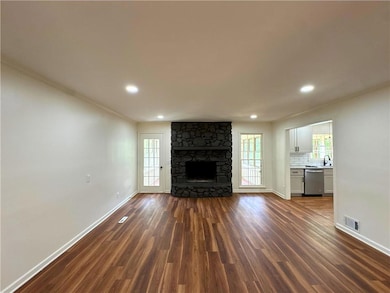 Unfurnished living room with baseboards, plenty of