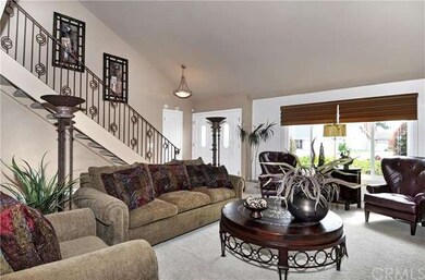 Tiled Foyer, Custom Wrought Iron Staircase, and Hu