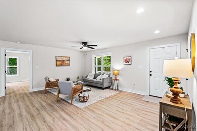 beyond family room is primary suite