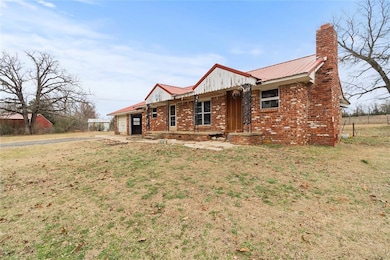 Single story home featuring a garage and a front l