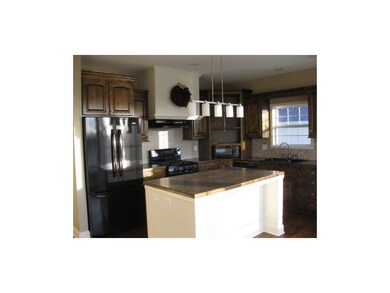 Large eat in kitchen with island, gas range and wo