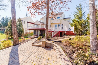 REAR EXTERIOR, 2 LEVEL DECK (43' X 24') W/ BUILT-I