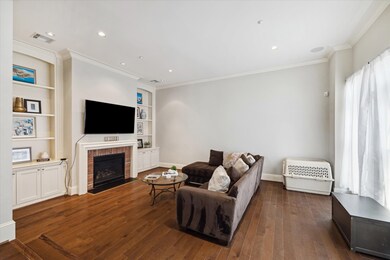 LIVING ROOM offers a gas-log fireplace flanked by
