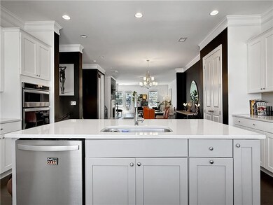 Kitchen with stainless steel appliances, quartz co