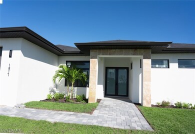View of exterior entry featuring french doors and