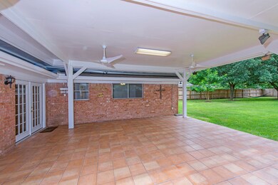 Beautiful extended covered patio, overlooking huge backyard!