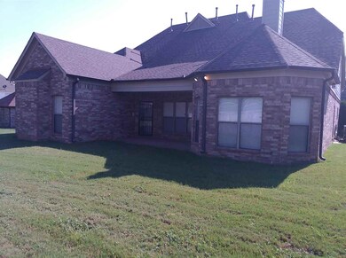 REAR WITH COVERED LARGE COVERED PATIO
