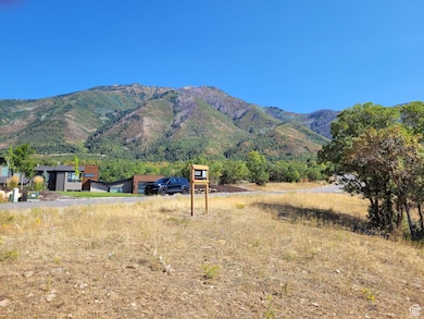View of mountain backdrop featuring rural landscape