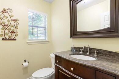 HALF BATH OFF THE BREAKFAST ROOM FEATURES MARBLED