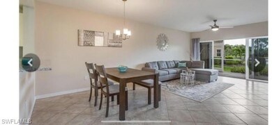 Dining area with light tile patterned floors, a ch