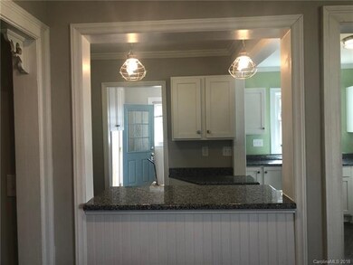 View from living room looking to bar/kitchen/dinin