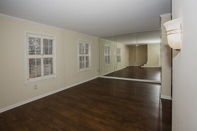 Mirrored wall makes living room look huge!