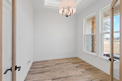 Spare room with crown molding, a healthy amount of