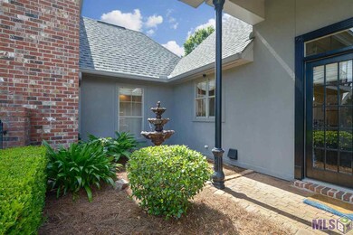 Pretty landscaped front entrance welcomes your gue