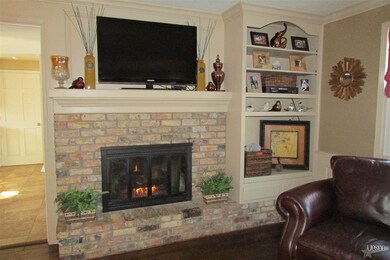 Brick Fireplace with Gas Log and Built in Book She