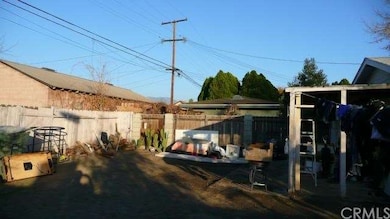 THERE IS A COVERED PATIO IN THE BACK YARD