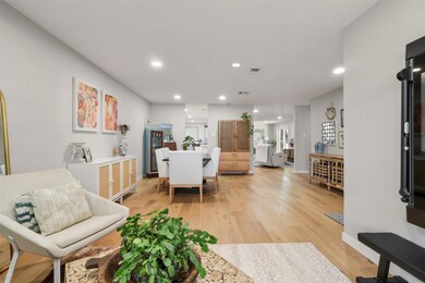 Living room with recessed lighting, visible vents,
