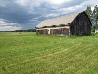 Large 8 stall barn has a tack room...