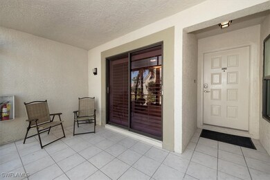 Doorway to property with stucco siding