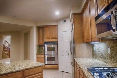 Kitchen has pantry, built-in refrigerator & double
