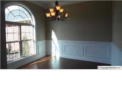 Dining room, wood flooring, shadow boxes, 10 foot ceiling.