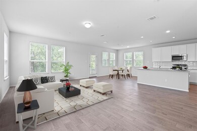Living room with light wood-type flooring and rec