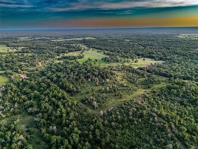 Aerial view of property and surrounding area with