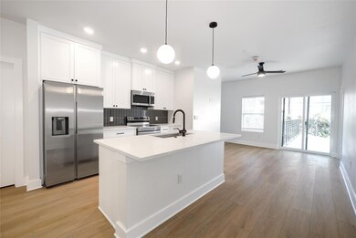 Kitchen featuring stainless steel appliances, a s